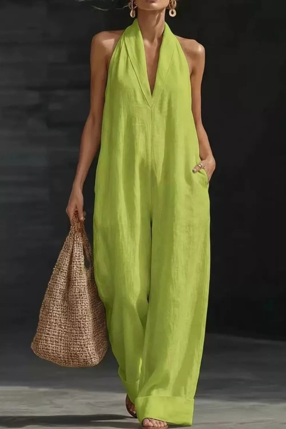 Women's sleeveless wide leg jumpsuit by Plush Fashion Hub with pockets, casual romper, made of comfortable fabric, in a stylish design.