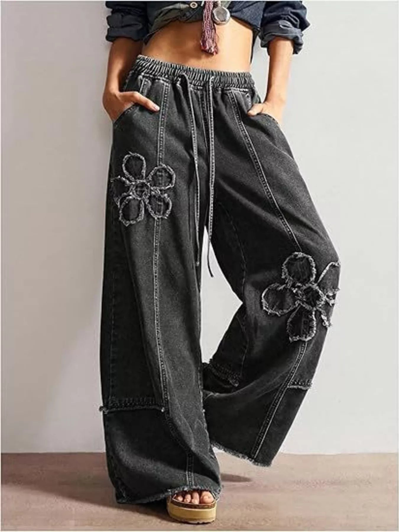 Floral appliques wide-leg jeans by Shopimist featuring embroidered flower designs on light denim fabric.