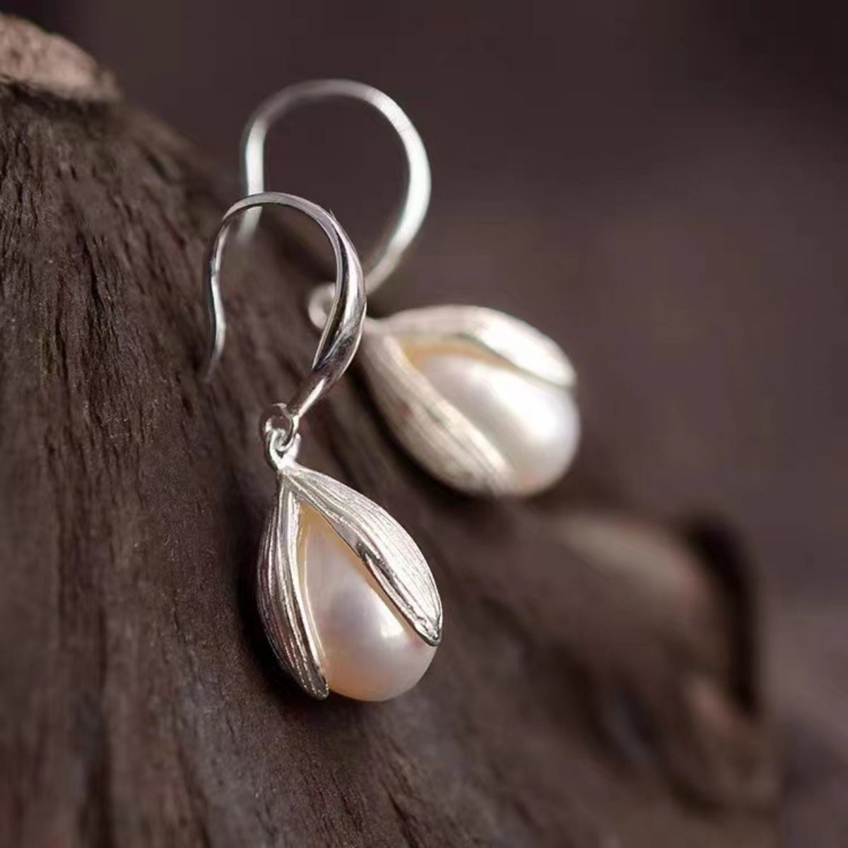 Sterling silver drop earrings with elegant design, crafted by Plush Fashion Hub, featuring polished silver finish and classic dangle style.