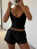 V-neck cami and shorts activewear set by Trendsi featuring a stylish, comfortable design for workout or casual wear.