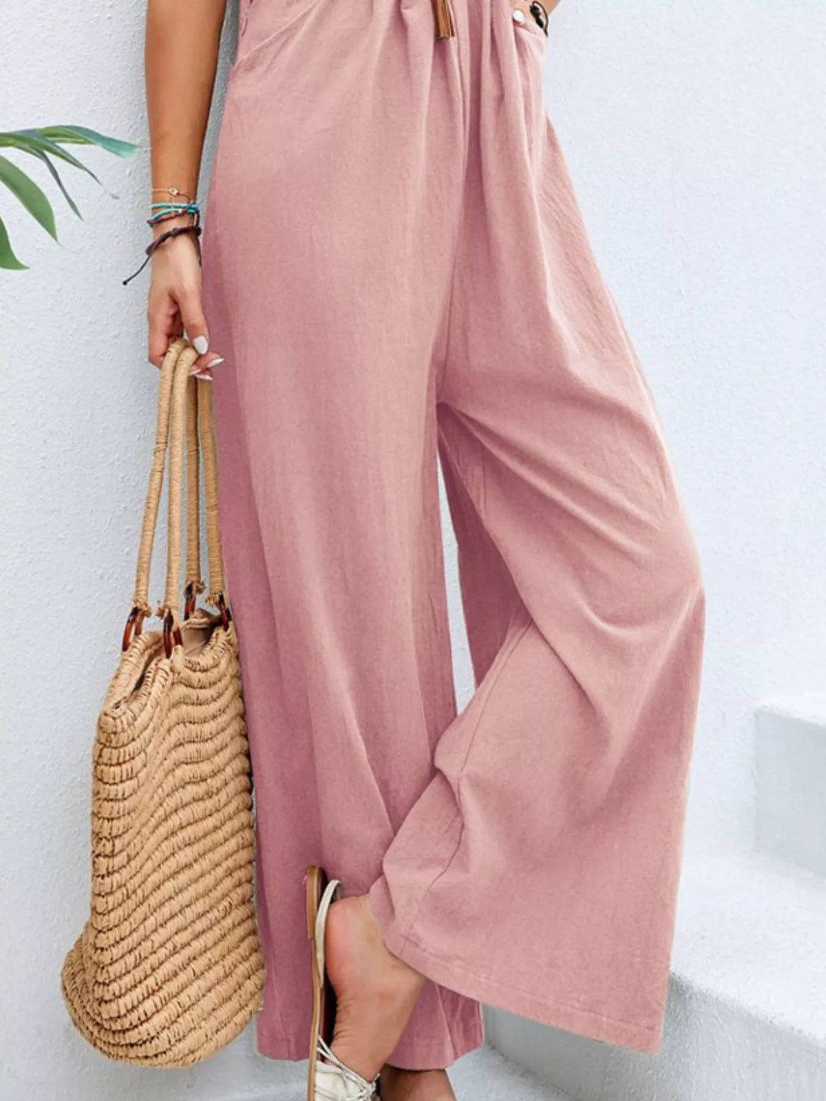 Plus size casual wide-leg jumpsuit with pockets by Plush Fashion Hub, featuring a full-length design and comfortable fit