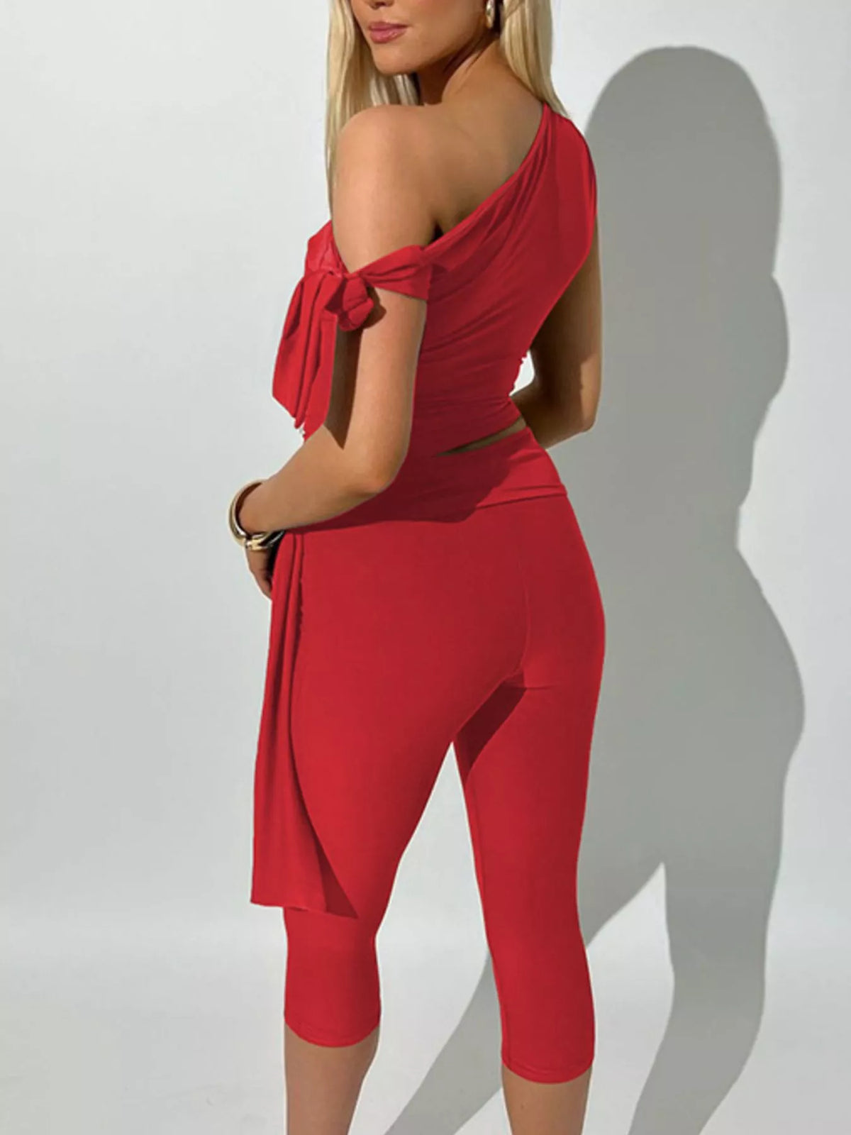 Asymmetrical one-shoulder top and matching capris set by Plush Fashion Hub, stylish women's fashion ensemble, flat lay image