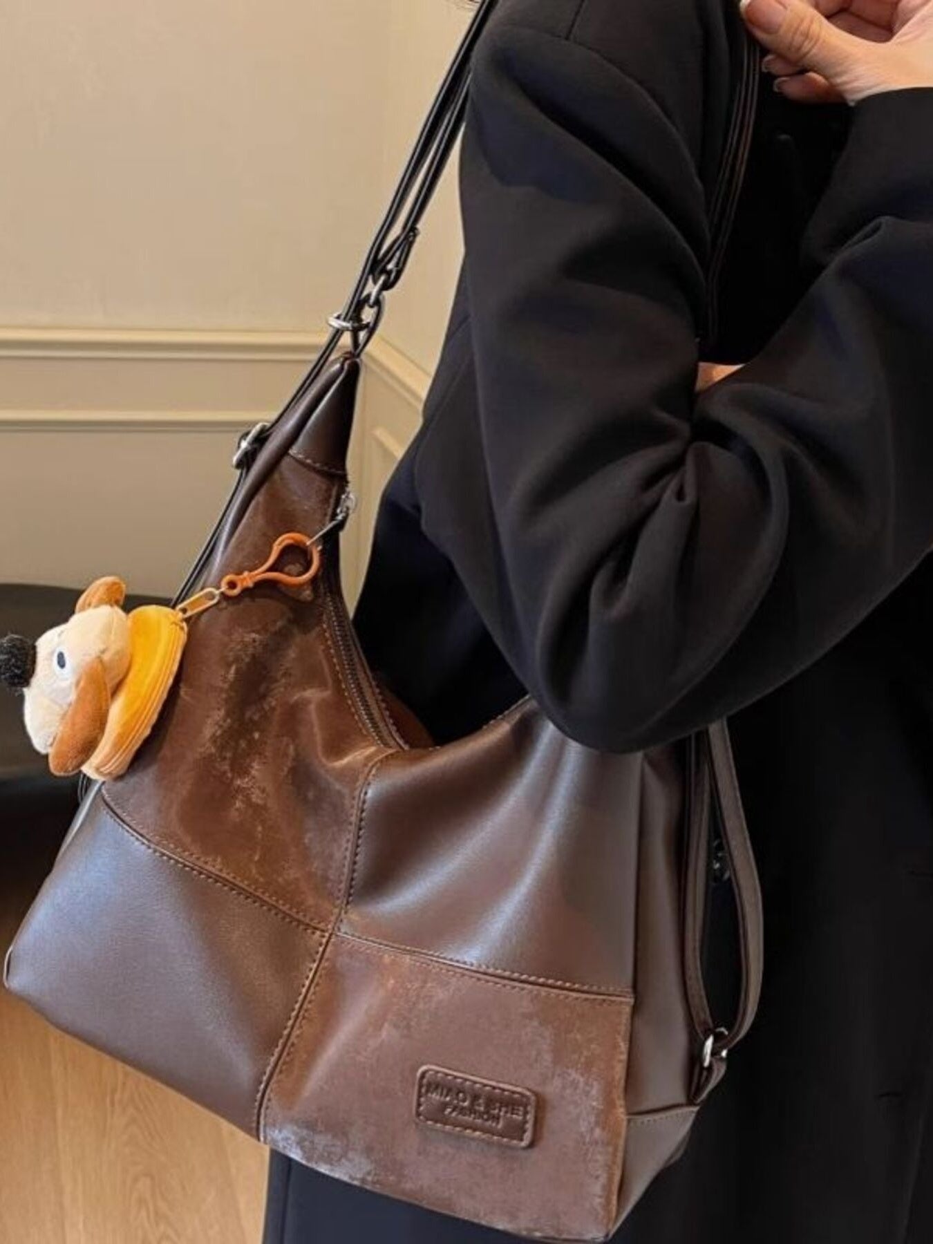 Vintage-inspired PU leather slouchy hobo shoulder bag with a relaxed design and spacious interior, crafted by Trendsi.