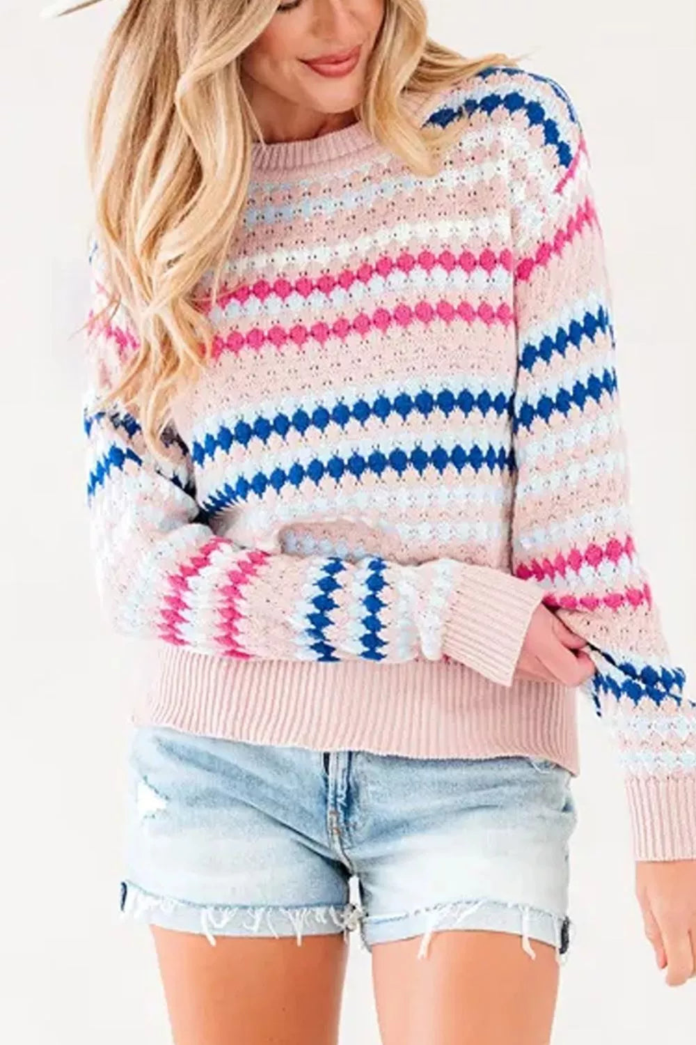 Women's striped geometric pattern sweater from Trendsi, featuring bold color blocks and cozy knit fabric.