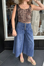 High-waisted wide-leg button-fly jeans in classic cotton denim by Trendsi, showing front view with pockets and button closure.