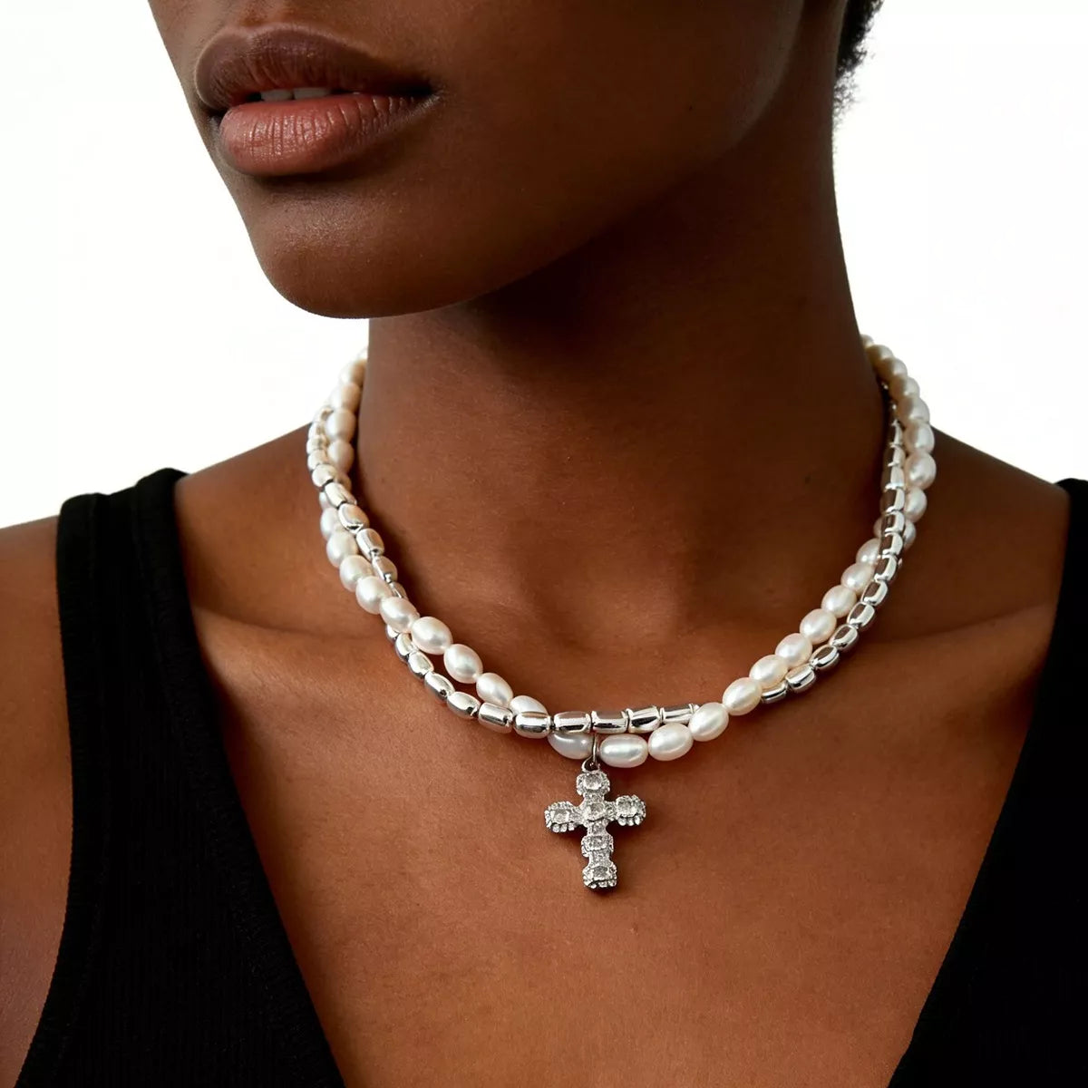 Elegant pearl alloy necklace with a rhinestone cross pendant, featuring a stylish design and intricate detailing.