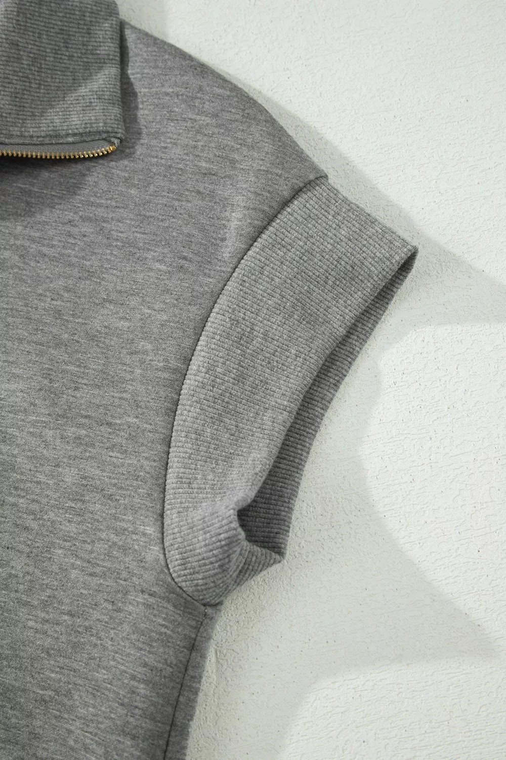 Casual men's polo tee and pants set featuring a half zip collar, in neutral tones, from Plush Fashion Hub.