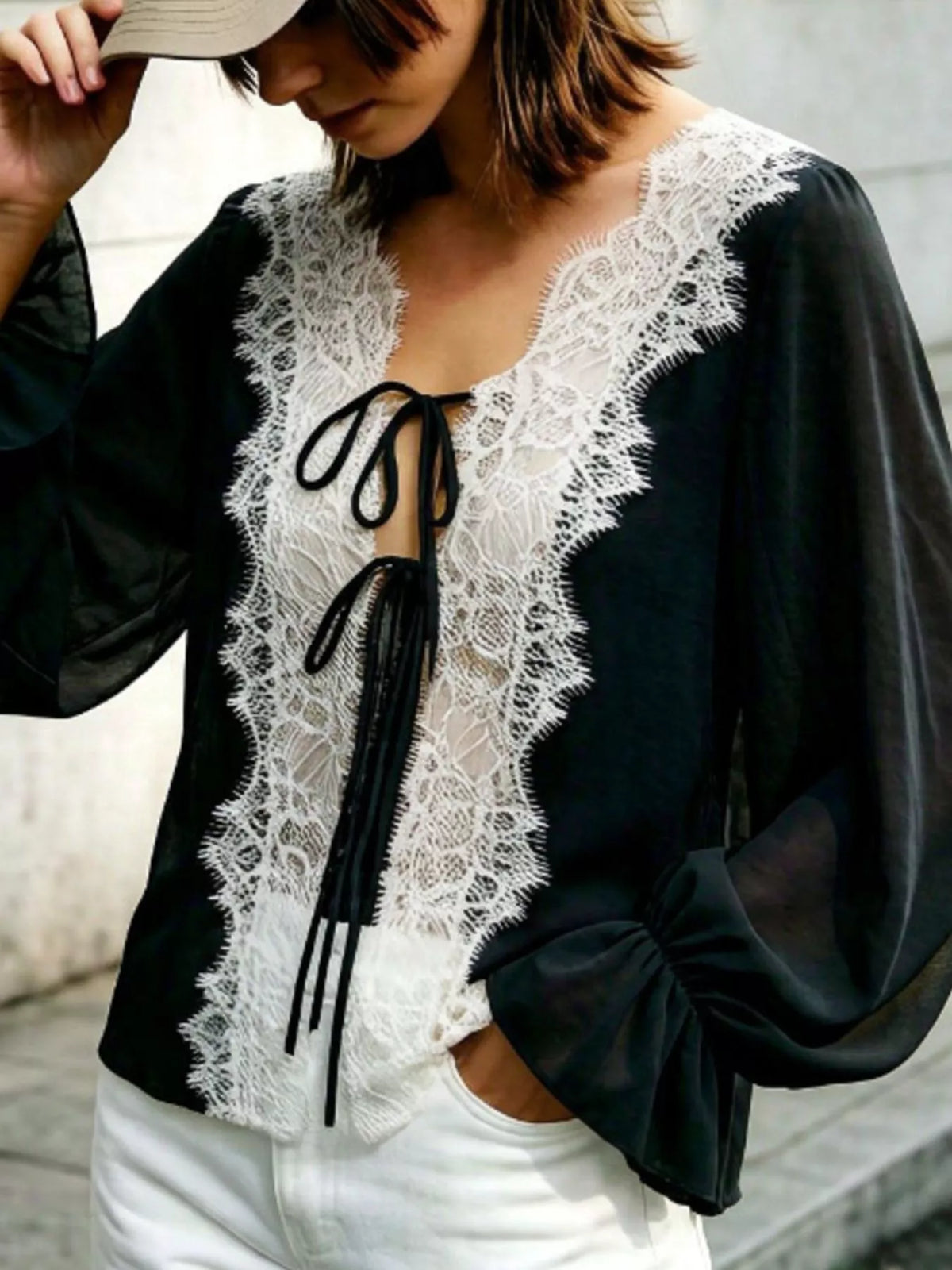 Sheer lace-trimmed front tie blouse for women, stylish and lightweight, featuring delicate lace details and a relaxed fit.