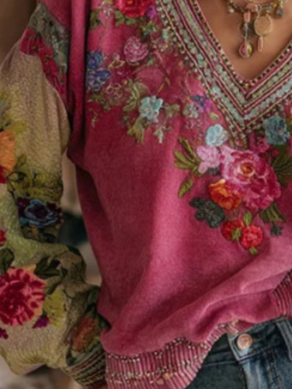 Plus size floral embroidered V-neck blouse by Trendsi, elegant women's top with intricate embroidery and lightweight fabric.