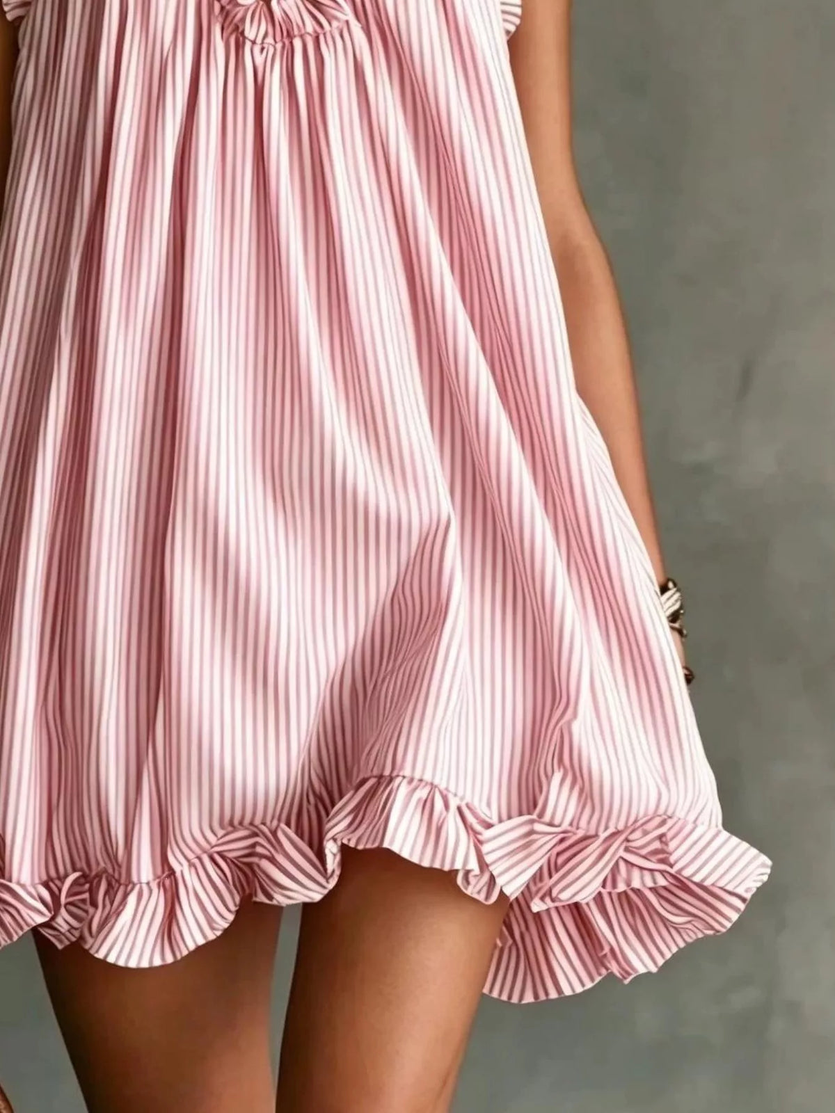 Plus size ruffled halter neck mini dress by Trendsi, showing the stylish ruffled design and halter neckline on the dress.