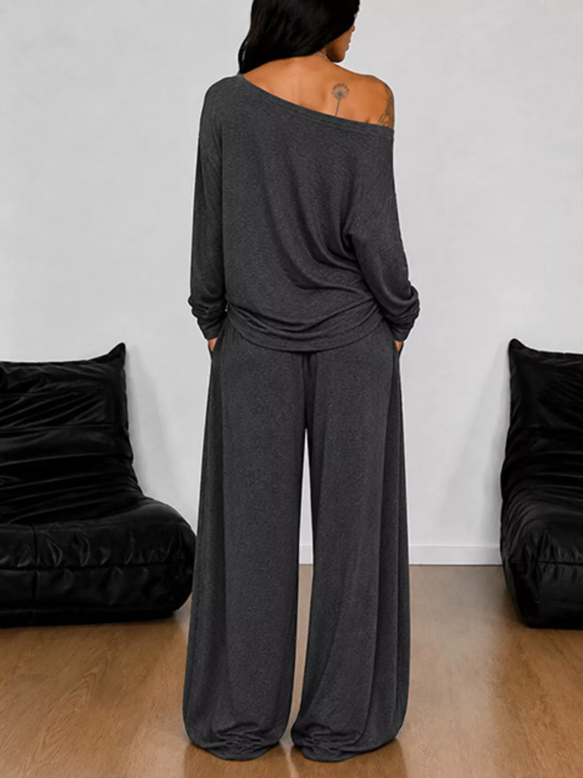 Plus size one-shoulder top and drawstring pants matching set by Trendsi, featuring a stylish, coordinated fashion ensemble.