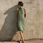 Women's sleeveless A-line midi dress in solid cotton linen fabric, featuring a casual, relaxed fit perfect for summer wear.