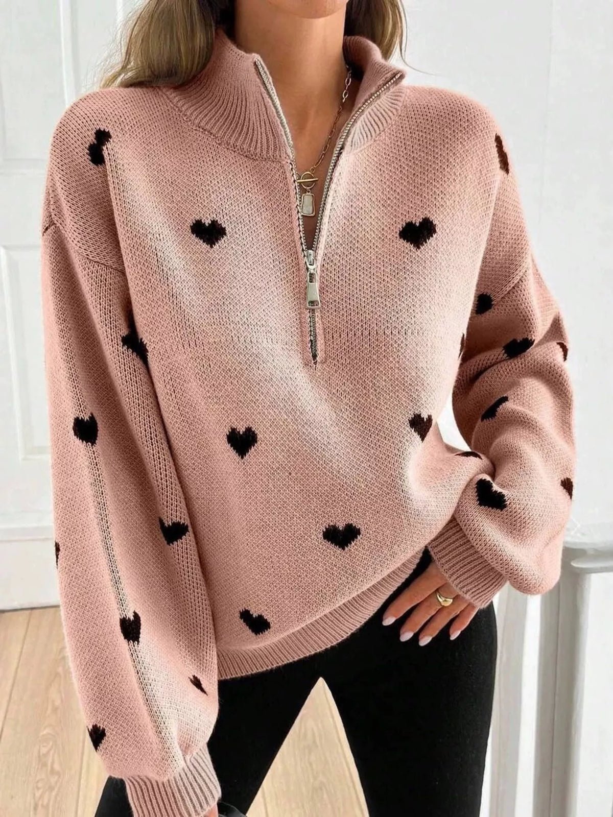 Plus size full heart half-zip long sleeve sweater by Trendsi, featuring a cozy design with a half-zip neckline and heart detail.