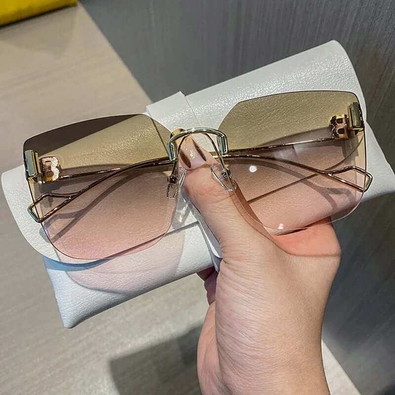 Vintage Brand Designer Sunglasses Fashion Oversized Rimless SunglassesElevate your style with our Vintage Brand Designer Sunglasses. Made with high-quality materials, these oversized rimless sunglasses offer 99% UV protection and 1.3 mSunglassesPlush Fashions ShopPlush Fashion Shop