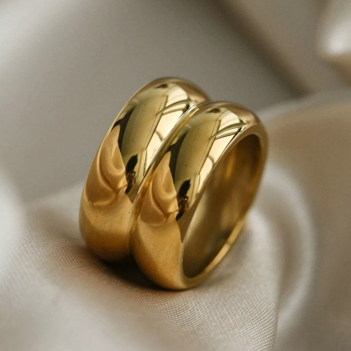 Gold double ridge ring from Plush Fashion Hub featuring a sleek, polished band with two textured ridges for stylish elegance.