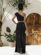 Trendsi one-shoulder top with matching ruched maxi skirt set, stylish and elegant fashion ensemble for women.