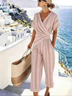 Casual women's loose irregular short-sleeve two-piece set by FitiqueFit, featuring a relaxed fit top and matching shorts.