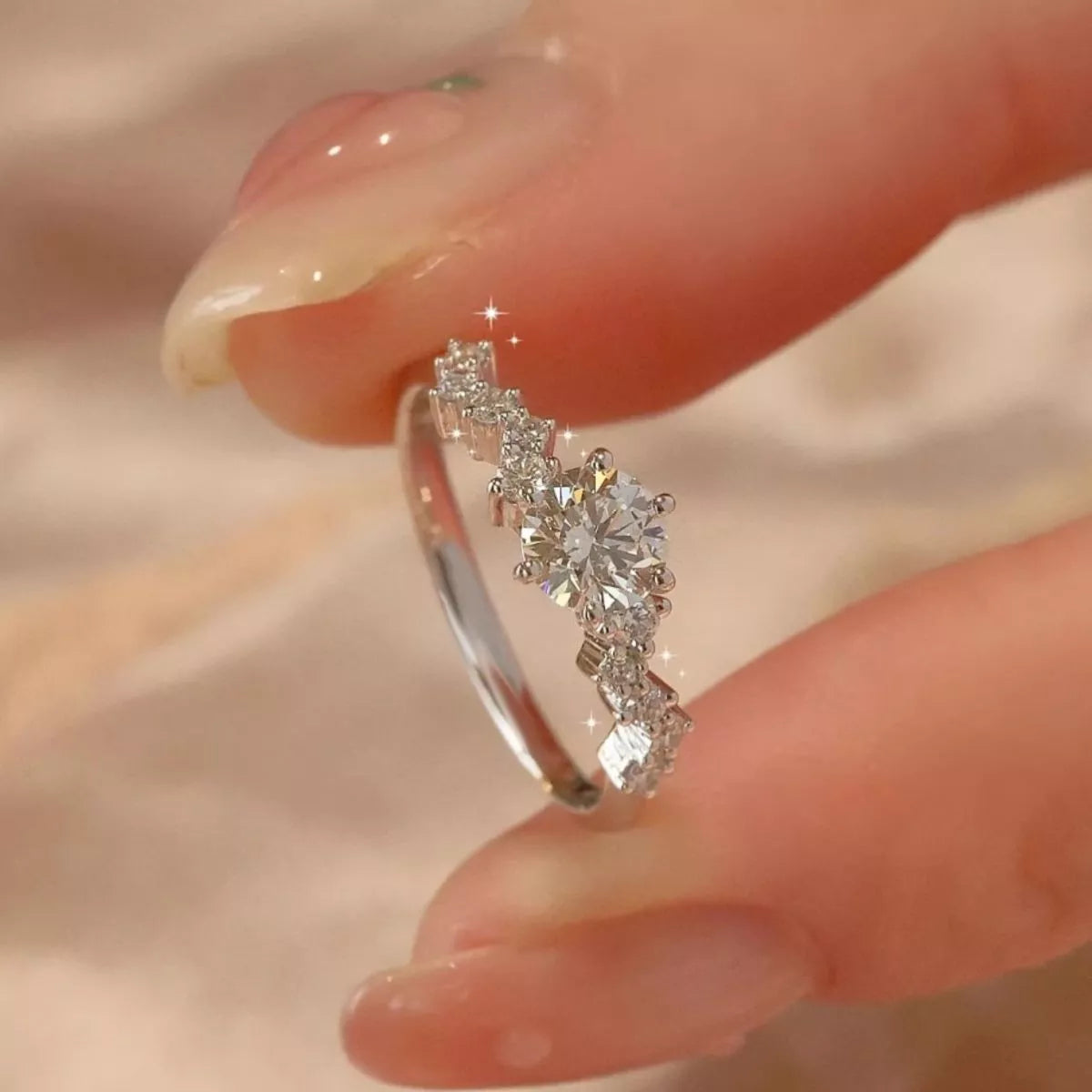 Sterling silver 2 carat moissanite ring with a sparkling round-cut stone, featuring a sleek band design.
