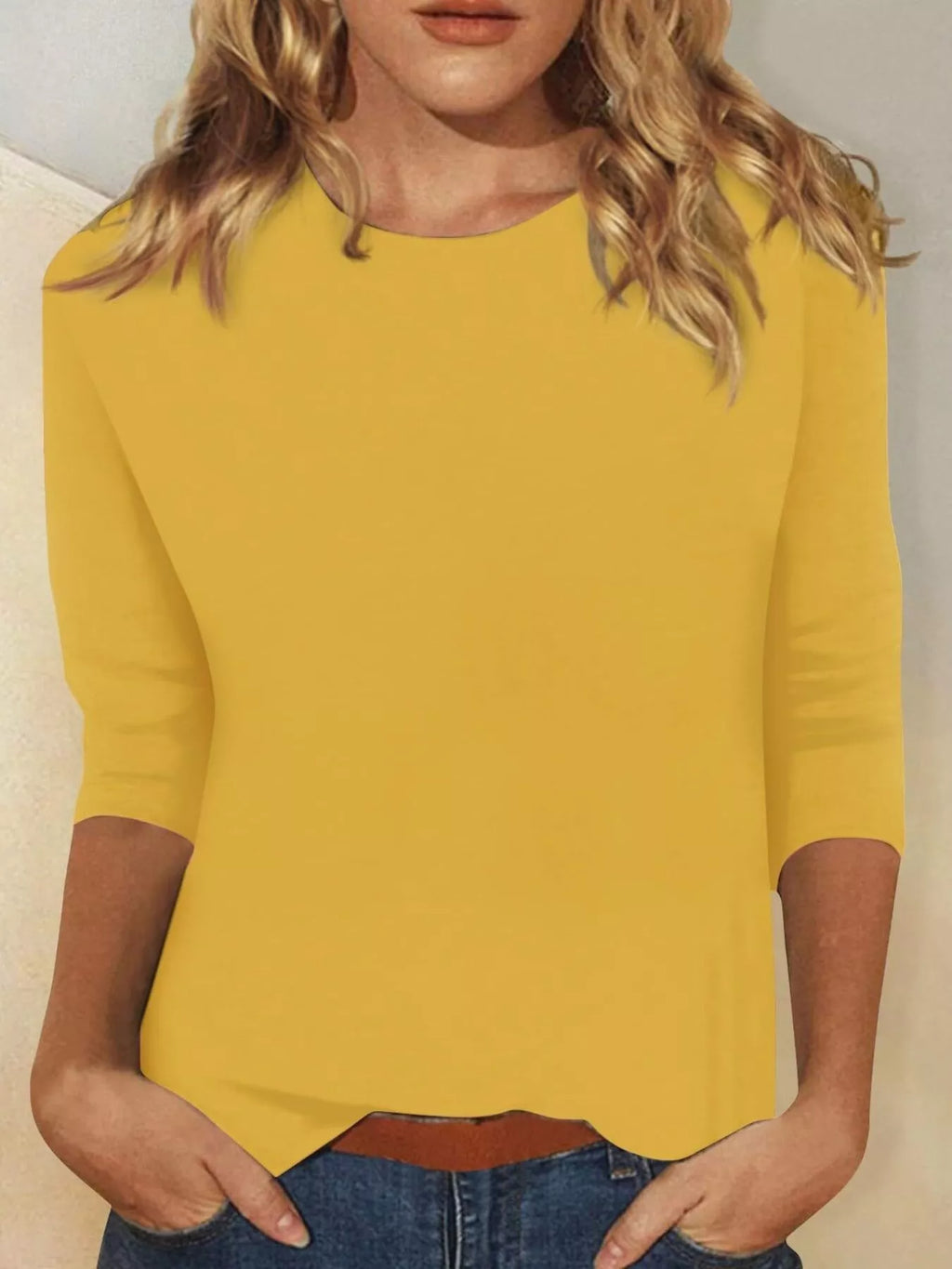 Solid color round neck T-shirt from Trendsi featuring a classic fit and smooth fabric in a simple, versatile design.