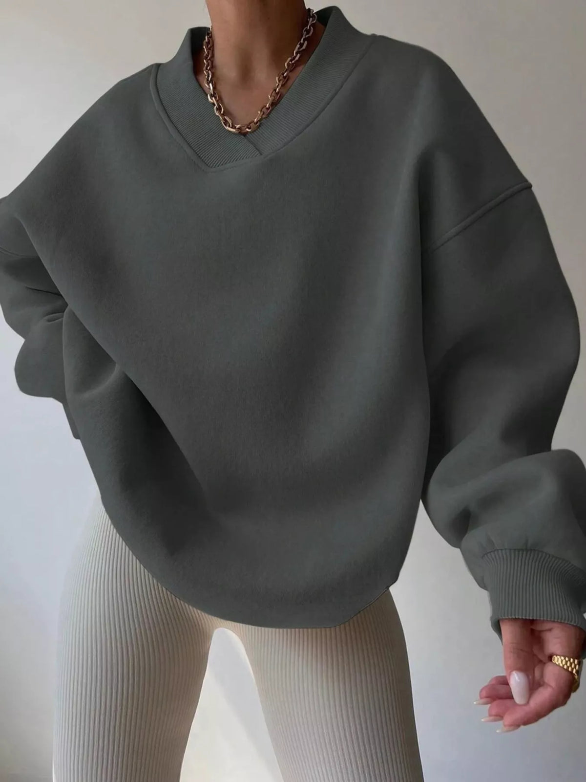 Oversized dropped shoulder long sleeve sweatshirt by Trendsi, featuring a relaxed fit and comfortable fabric, shown in a front view.