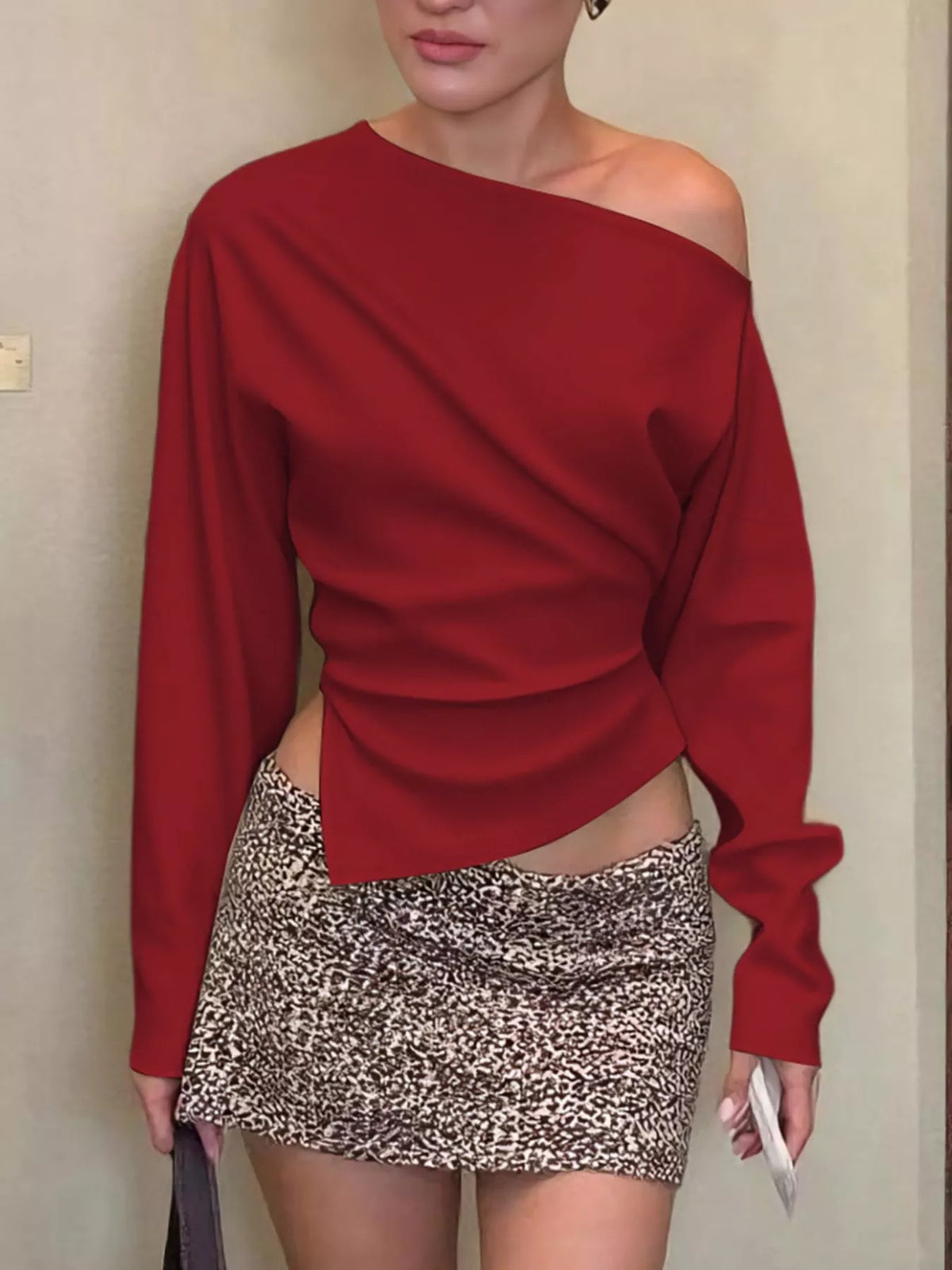 Asymmetrical off-shoulder long sleeve top by Plush Fashion Hub, featuring a stylish design and fitted long sleeves.