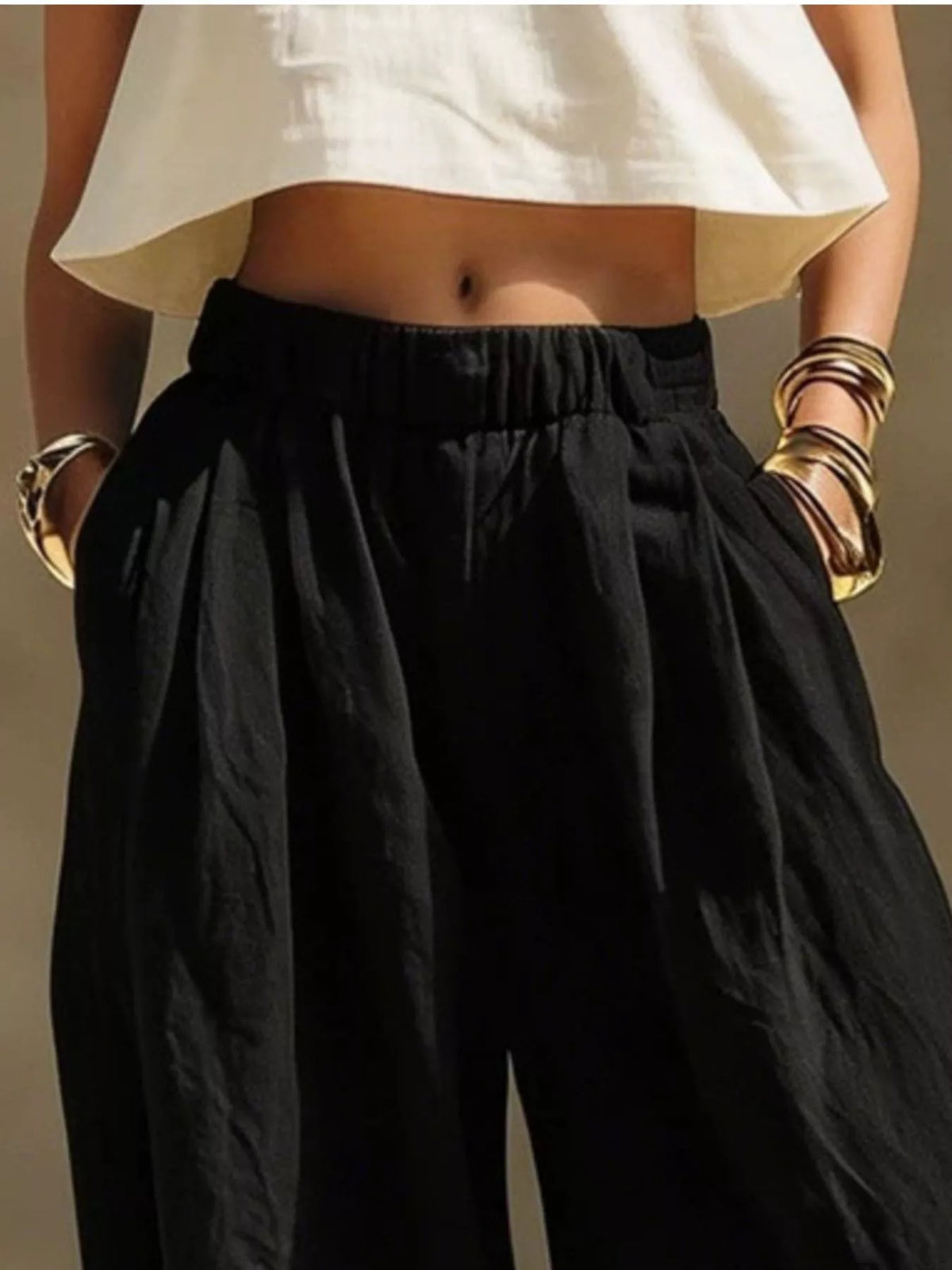 Plus size wide leg pants with full elastic waistband, stylish and comfortable Trendsi pants shown in the image.