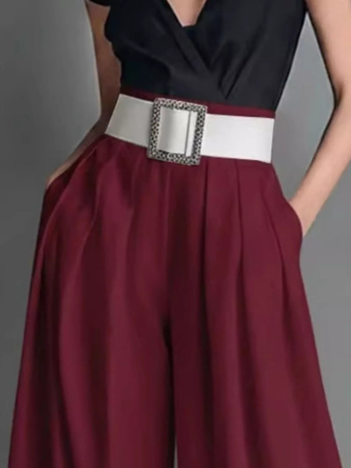 High-waisted wide-leg pants from Plush Fashion Hub, shown on a model, in a neutral color with a flowy, relaxed fit.