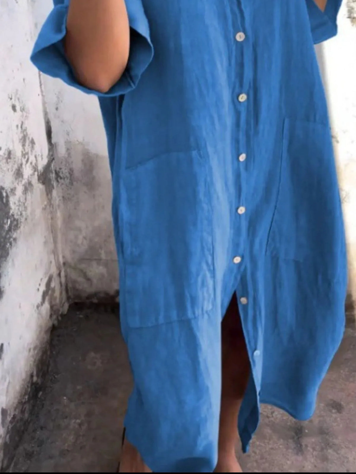 Plus size casual linen button-down shirt dress by Trendsi, featuring a relaxed fit, collar, and long sleeves on a model.