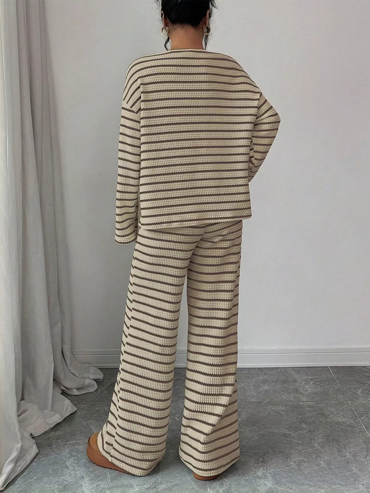 Striped knit dropped shoulder top and pants set by Trendsi, featuring a cozy, stylish matching outfit with relaxed fit.