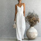 Women's sleeveless wide-leg jumpsuit by FitiqueFit in multiple colors, styled on a model, showcasing relaxed fit and trendy design.