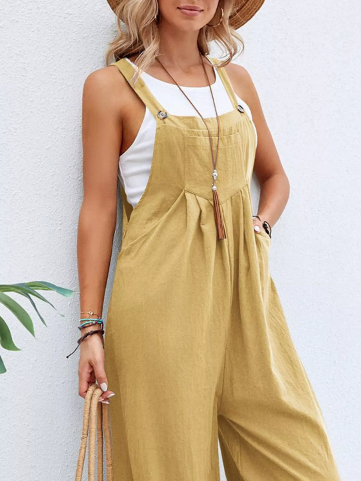 Plus size casual wide-leg jumpsuit with pockets from Plush Fashion Hub, featuring a full-size fit and comfortable design.