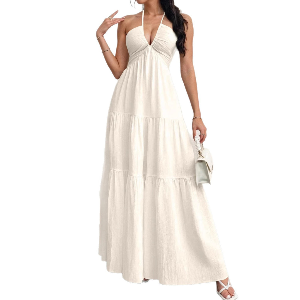 Backless halterneck v-neck pleated A-line dress from Plush Fashion Hub, featuring a flowing design and elegant style.