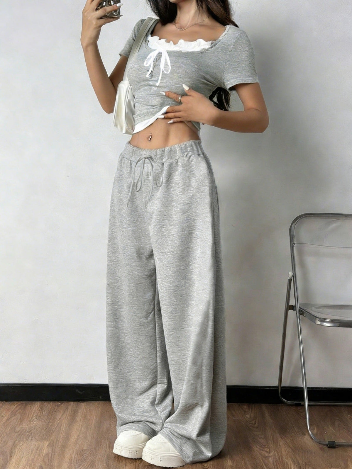 Plush Fashion Hub tie front short sleeve top and matching pants set, casual two-piece outfit, lightweight and stylish for everyday wear.