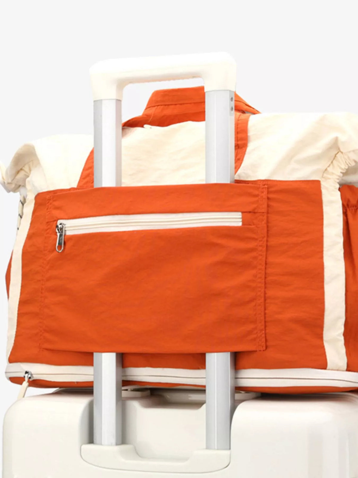 Color-block travel bag by Plush Fashion Hub, showing a stylish multi-color design with handles and spacious interior.