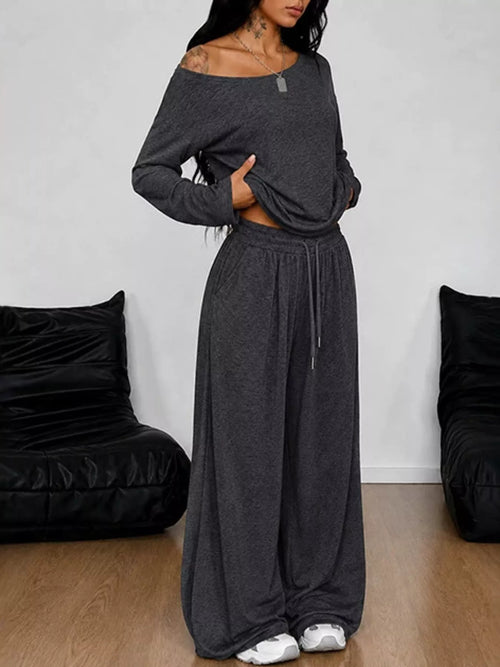 Plus size full size one-shoulder top and drawstring pants set by Trendsi, featuring stylish matching top and pants ensemble.