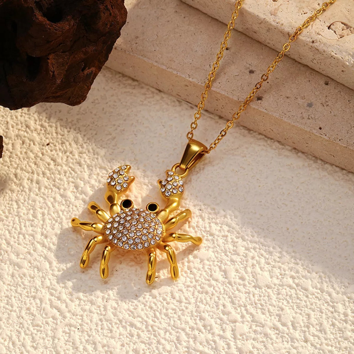 Gold-plated crab pendant necklace from Plush Fashion Hub featuring an 18K gold finish, detailed crab charm on a delicate chain.