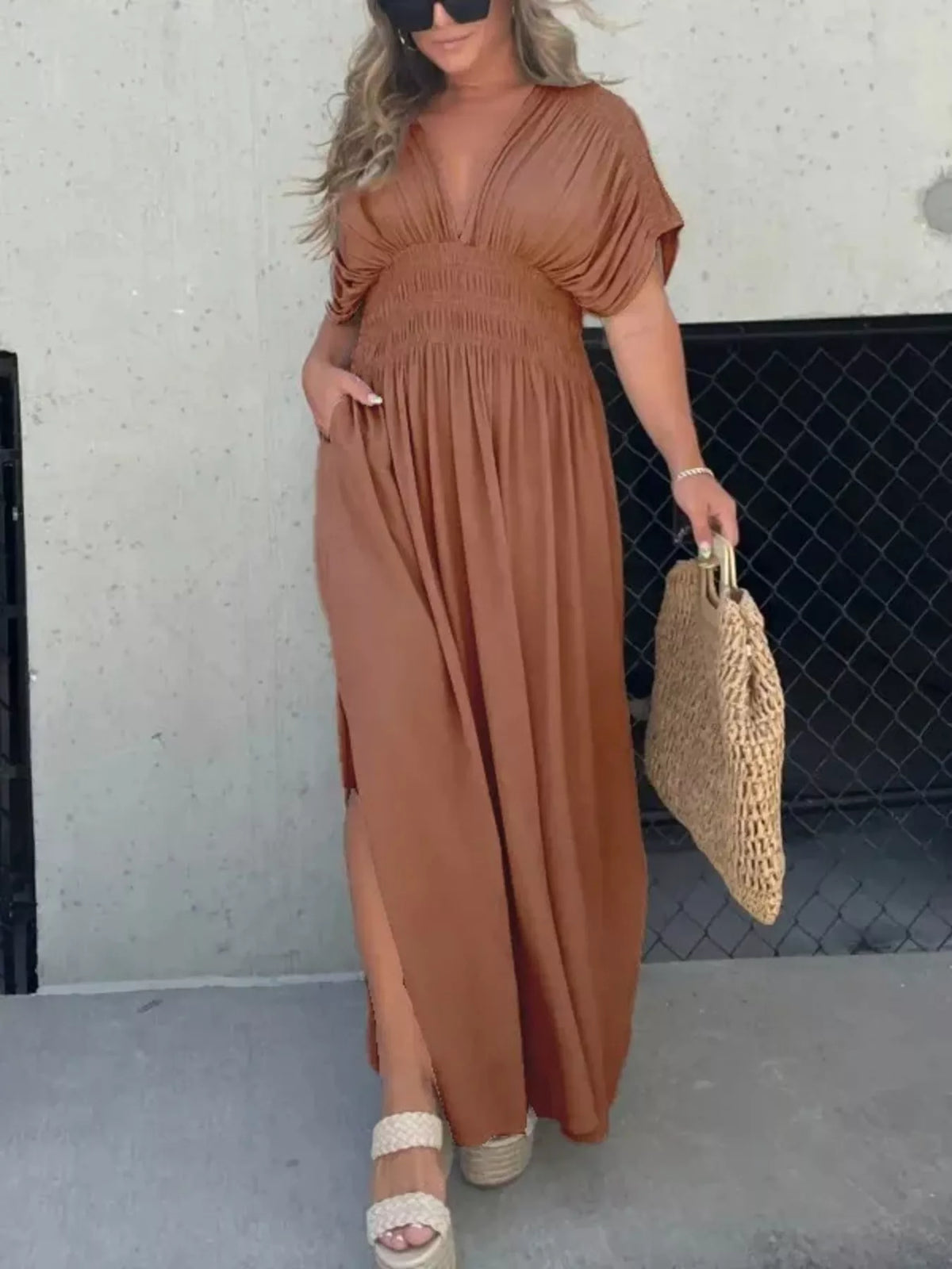 Plus size full slit V-neck maxi dress with smocked waist by Plush Fashion Hub, shown with flowing fabric and stylish design.