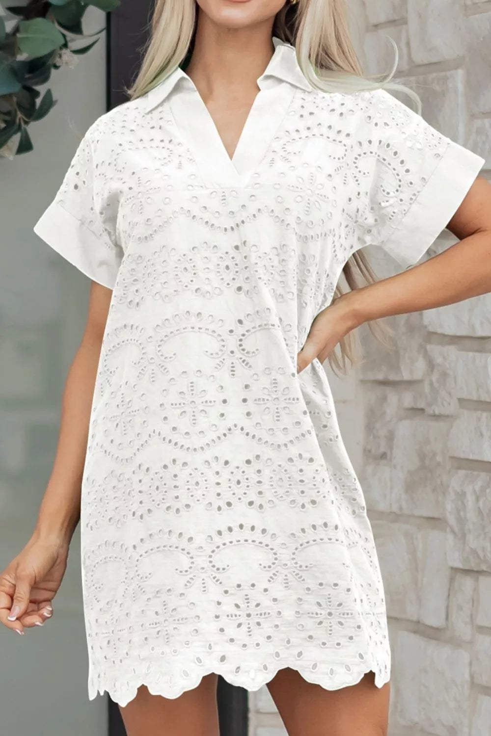 Solid color eyelet embroidered T-shirt mini dress by Plush Fashion Hub, featuring eyelet details and a casual T-shirt style.