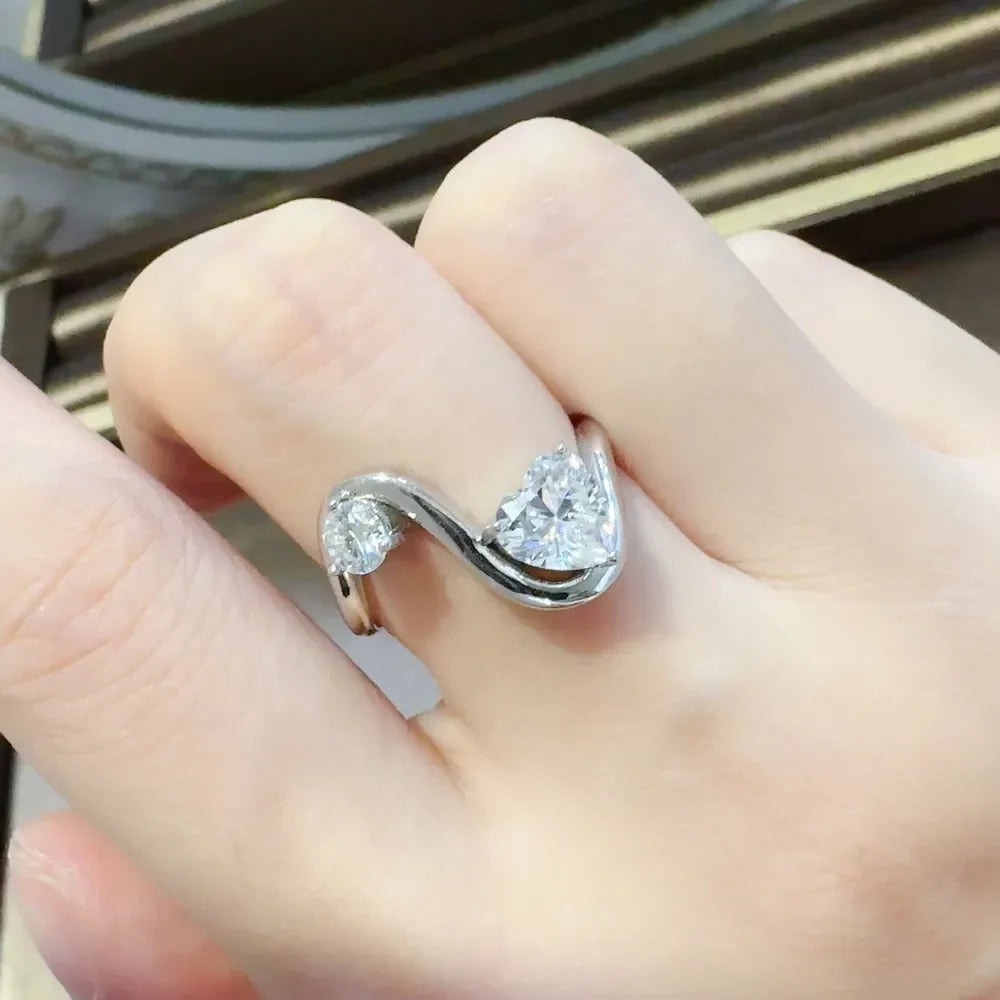 Irregular shape 1.3 carat moissanite ring in 925 sterling silver, showcasing a unique design and sparkling gemstone.