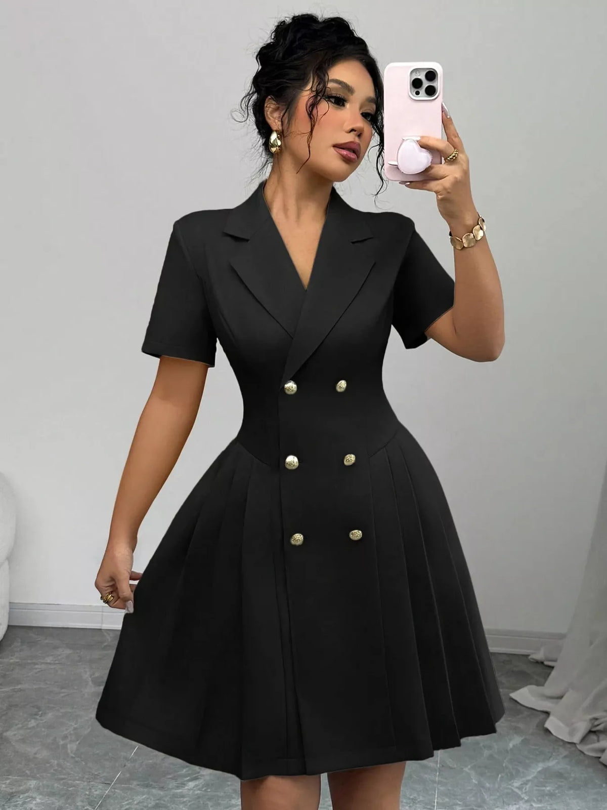 Double-breasted pleated blazer dress in black by Plush Fashion Hub, shown on a mannequin with a tailored fit and stylish lapel details.