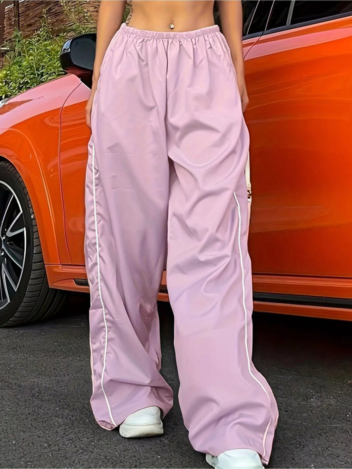 Women's lightweight high-rise wide-leg dress pants with elastic waist by Plush Fashion Hub, shown in a flowing, relaxed fit style.