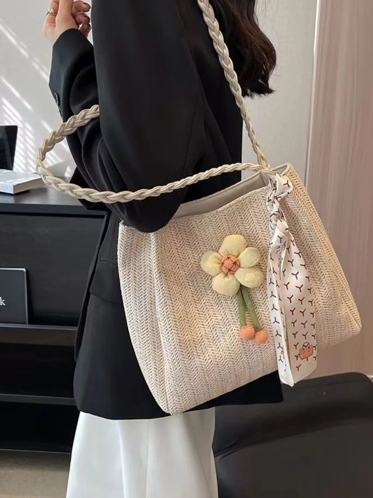 Woven straw tote bag with floral decor from Plush Fashion Hub, showing natural straw texture and colorful floral accents.