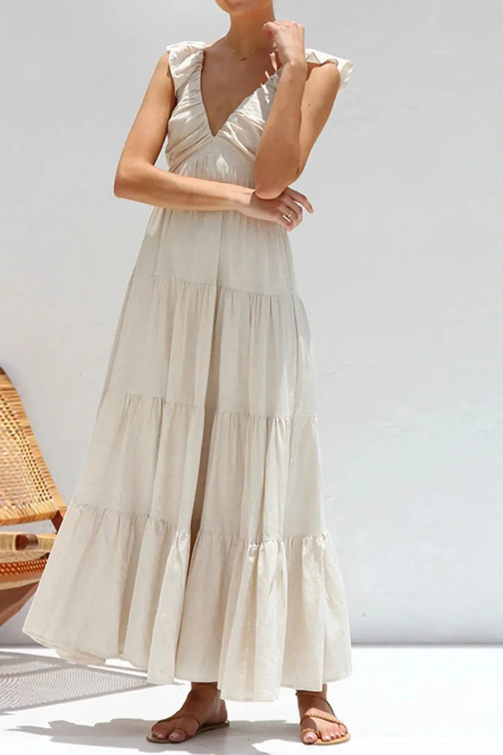Women's 100% cotton ruffled v-neck tiered midi dress with feminine design, featuring ruffles and a relaxed fit.