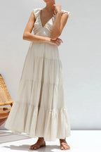 Women's 100% cotton ruffled v-neck tiered midi dress with feminine design, featuring ruffles and a relaxed fit.