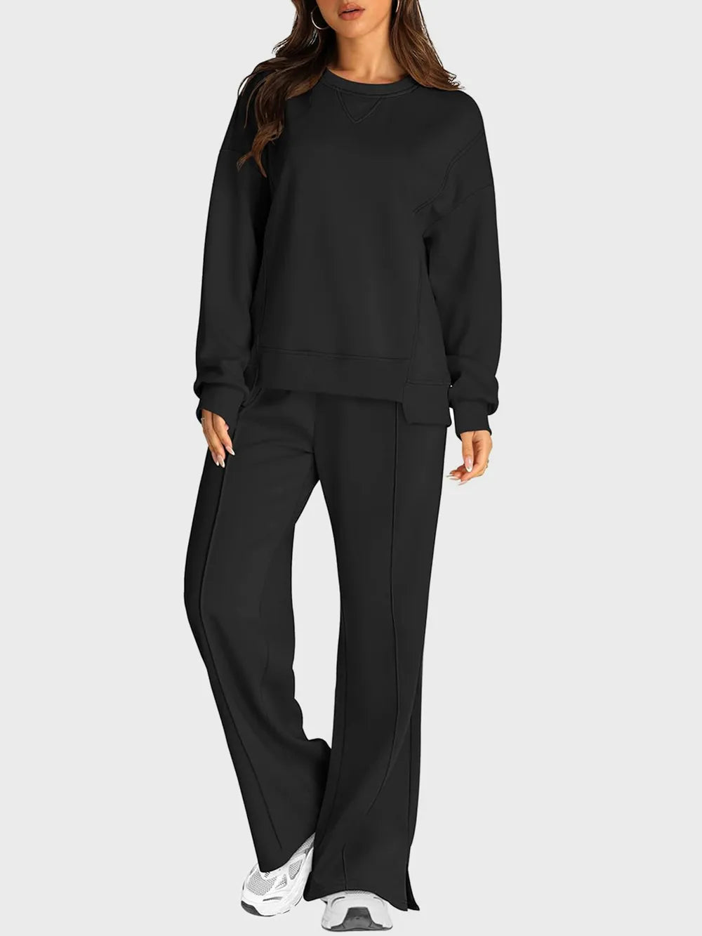 Trendsi round neck long sleeve top with slit pants set, featuring a stylish top and matching slit pants in a coordinated outfit.
