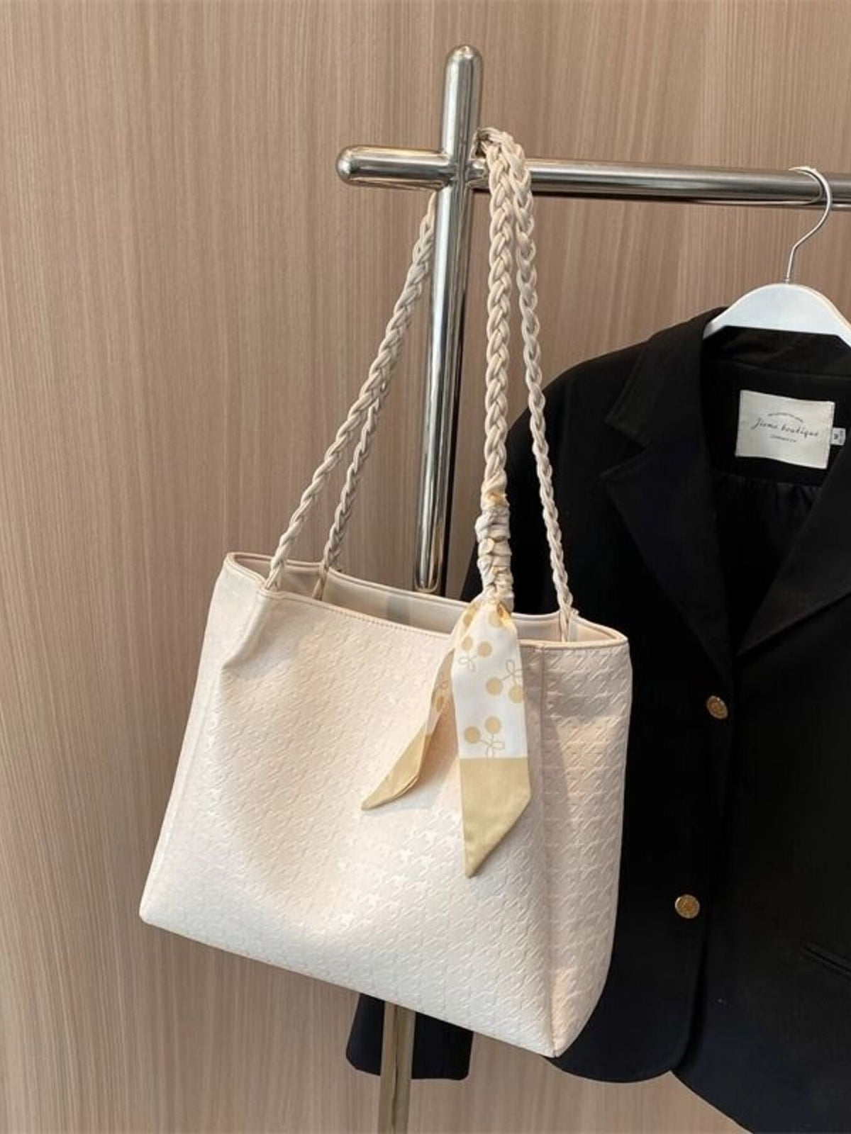 Plush Fashion Hub braided handle tote bag featuring woven handles and spacious interior, perfect for everyday use.
