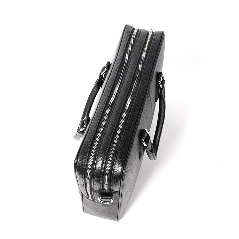 Pi-Mart men's leather briefcase with large capacity, cowhide horizontal handbag showing sturdy handle and spacious compartments.