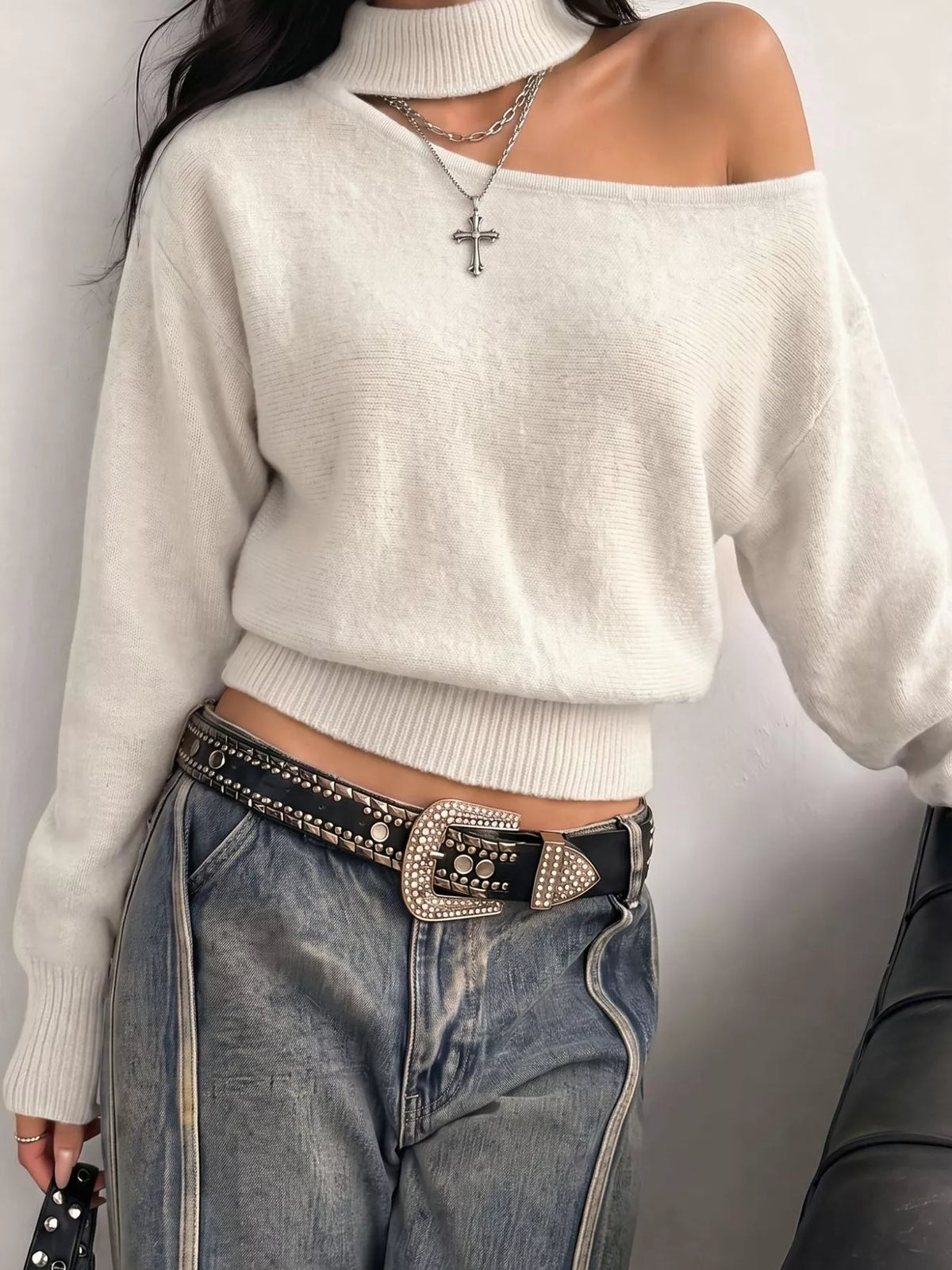 Cold-shoulder dropped shoulder sweater by Trendsi, featuring a cozy knit design with cut-out shoulder details and relaxed fit.