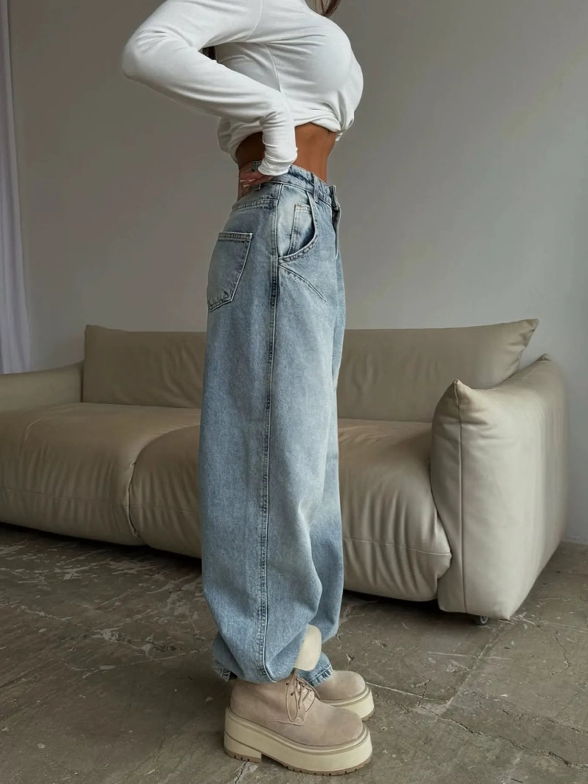 Plush Fashion Hub wide-leg denim jeans with a relaxed fit, featuring classic blue denim fabric and stylish stitching details.