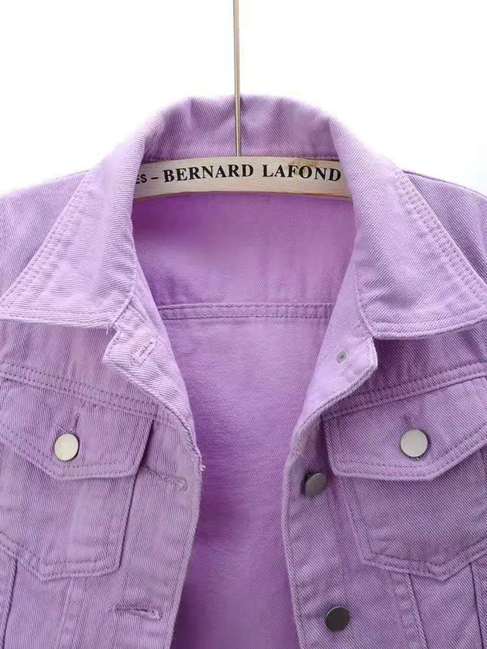Plus size cropped denim jacket from Trendsi, full-length style, showing the classic blue denim fabric and button closure.